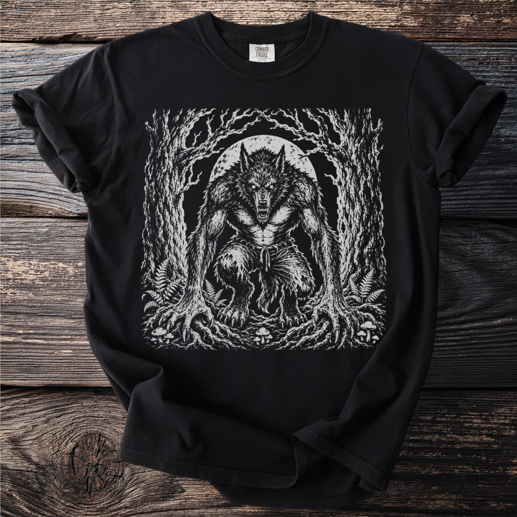 Black t-shirt with a detailed print of a snarling werewolf in a forest under a full moon.