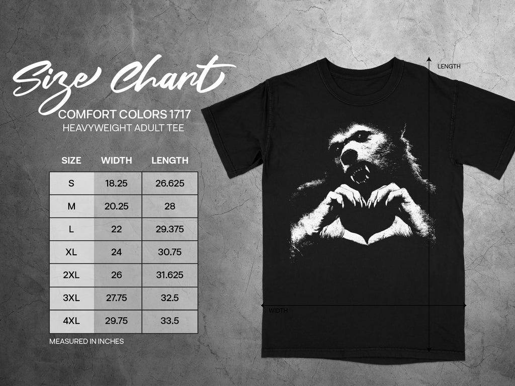 Size chart for a black heavyweight adult tee with a wolf graphic.