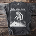 Dark grey t-shirt with graphic of a werewolf and the text "take your time".