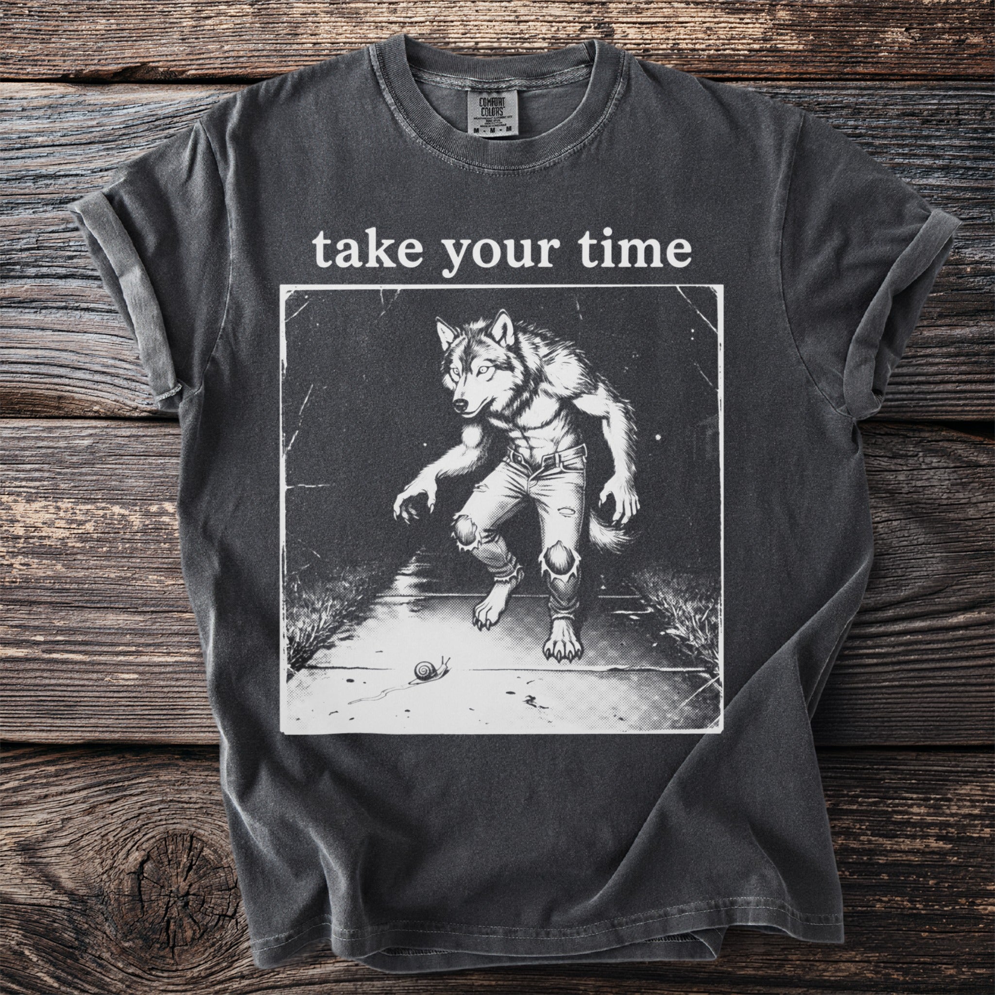 Dark grey t-shirt with graphic of a werewolf and the text "take your time".