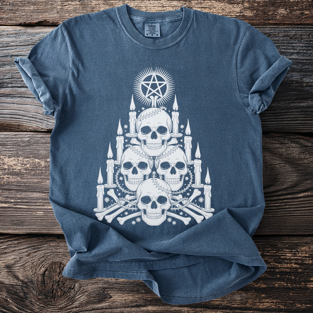 Blue t-shirt with white graphic of skulls, candles, bones, and a pentagram.
