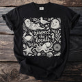 Black t-shirt with white illustration of sea creatures and text "respect the locals".