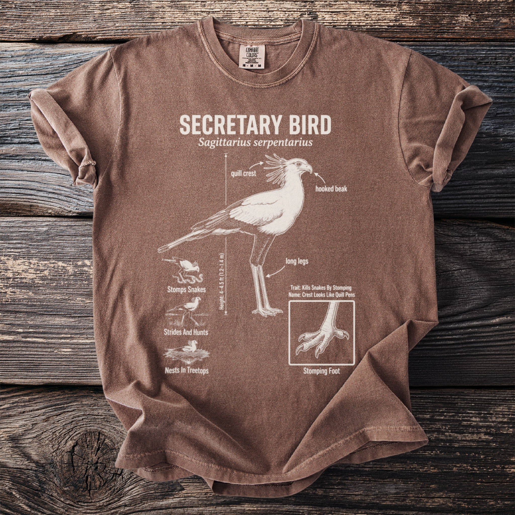 Brown t-shirt with detailed illustration of a Secretary Bird and its features.