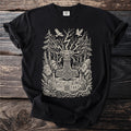 Black t-shirt featuring Thor's hammer, trees, birds, candles, and runes.