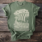 Green t-shirt with a cream graphic of a Viking ship, birds, and runes.