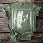 Olive green comfort colors t-shirt with "please do not perceive me" and a black cat graphic.