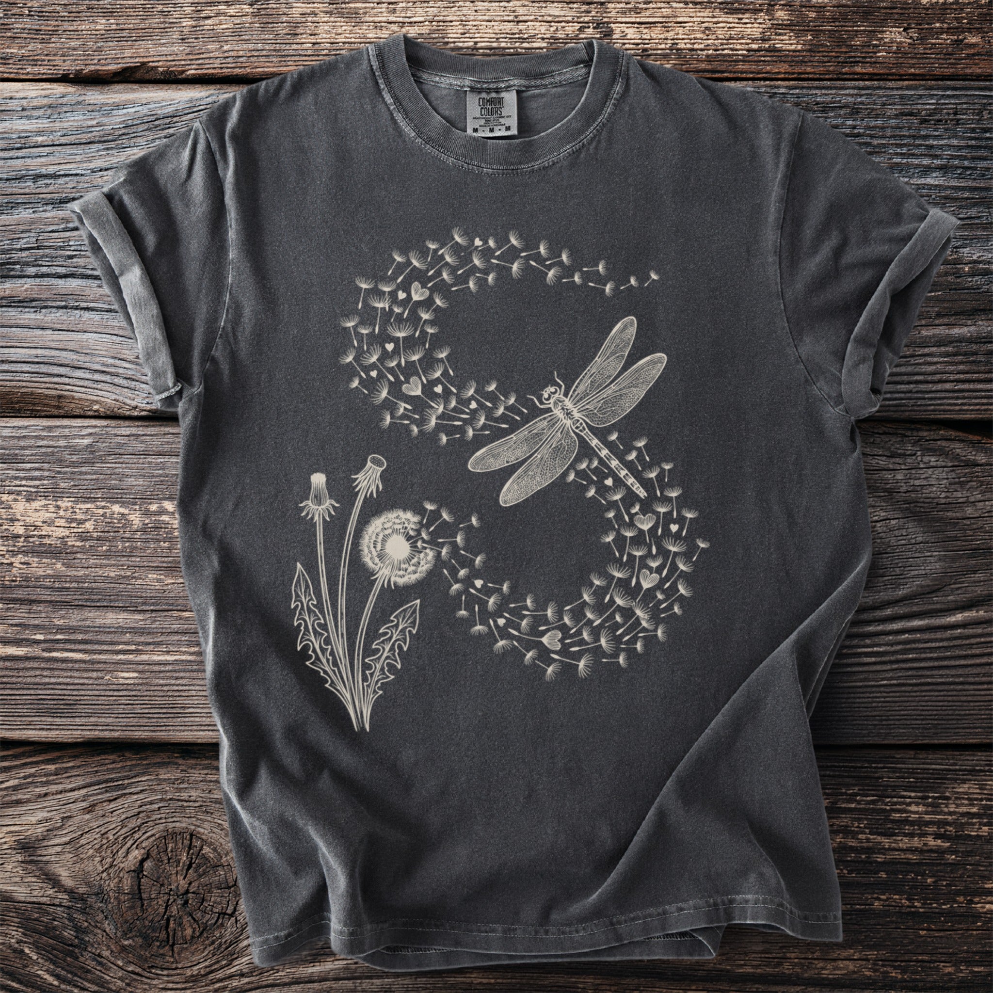 Dark grey t-shirt with a cream dragonfly and dandelion puff print.