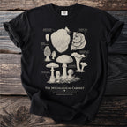 Black t-shirt with vintage forest fungi illustrations and text: "The Myocological Cabinet".