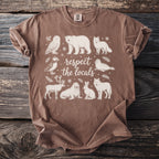 Brown t-shirt with white line art of Arctic animals and text "respect the locals".
