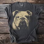 Dark t-shirt with a beige imprint of a bulldog's face wearing a spiked collar.