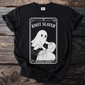Black t-shirt with "Knot Slayer" tarot card design featuring a ghost giving a massage.