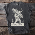 Pepper gray t-shirt with a cream folk-cut print: the Minotaur walks through the snow with a huge Yule log over his shoulder.