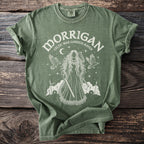 Green t-shirt with white graphic of Morrigan, Celtic war goddess raven.