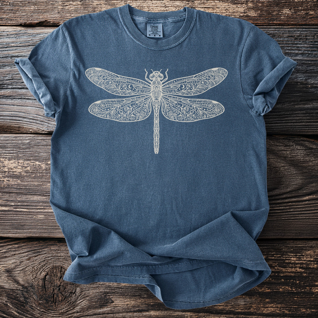 Blue t-shirt with a white ornamental dragonfly graphic and Comfort Colors label.