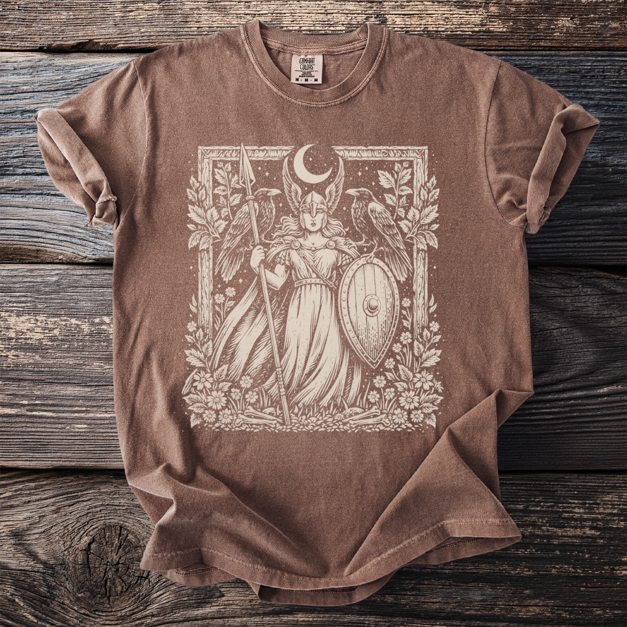 Brown t-shirt with cream graphic of a winged warrior holding a spear and shield.