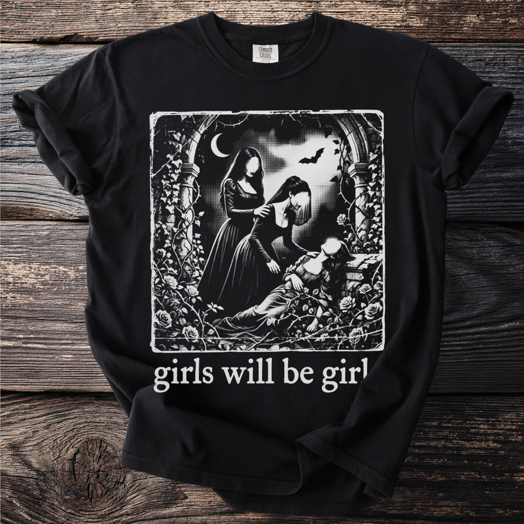 Black t-shirt with graphic of three women in gothic attire with bats and roses, text "girls will be girl."