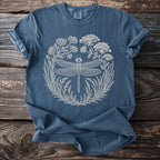 Blue t-shirt with cream dragonfly and floral circular graphic.