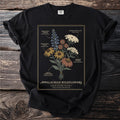 Black t-shirt with "Appalachian Wildflowers Field Guide Plate I" and illustrated flowers.