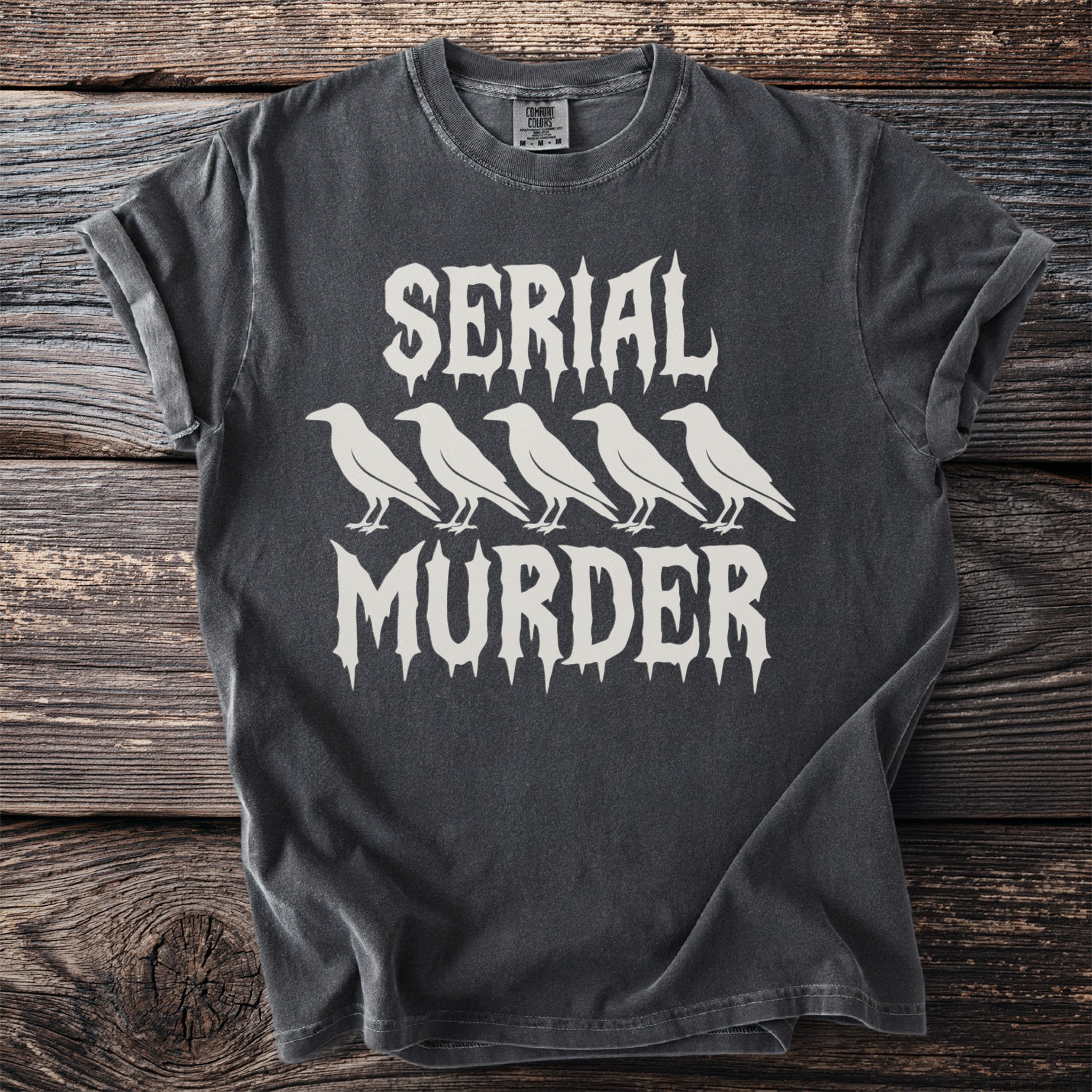 Charcoal t-shirt with white text "SERIAL MURDER" and five crows.