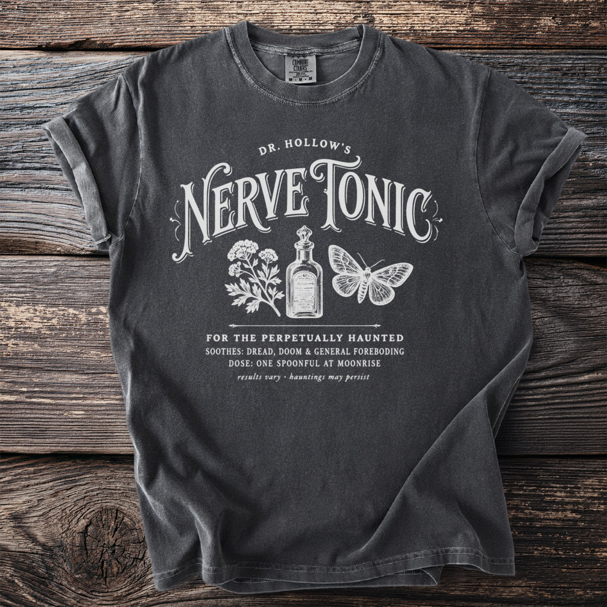 Dark gray t-shirt with "Dr. Hollow's Nerve Tonic" and spooky potion graphics.