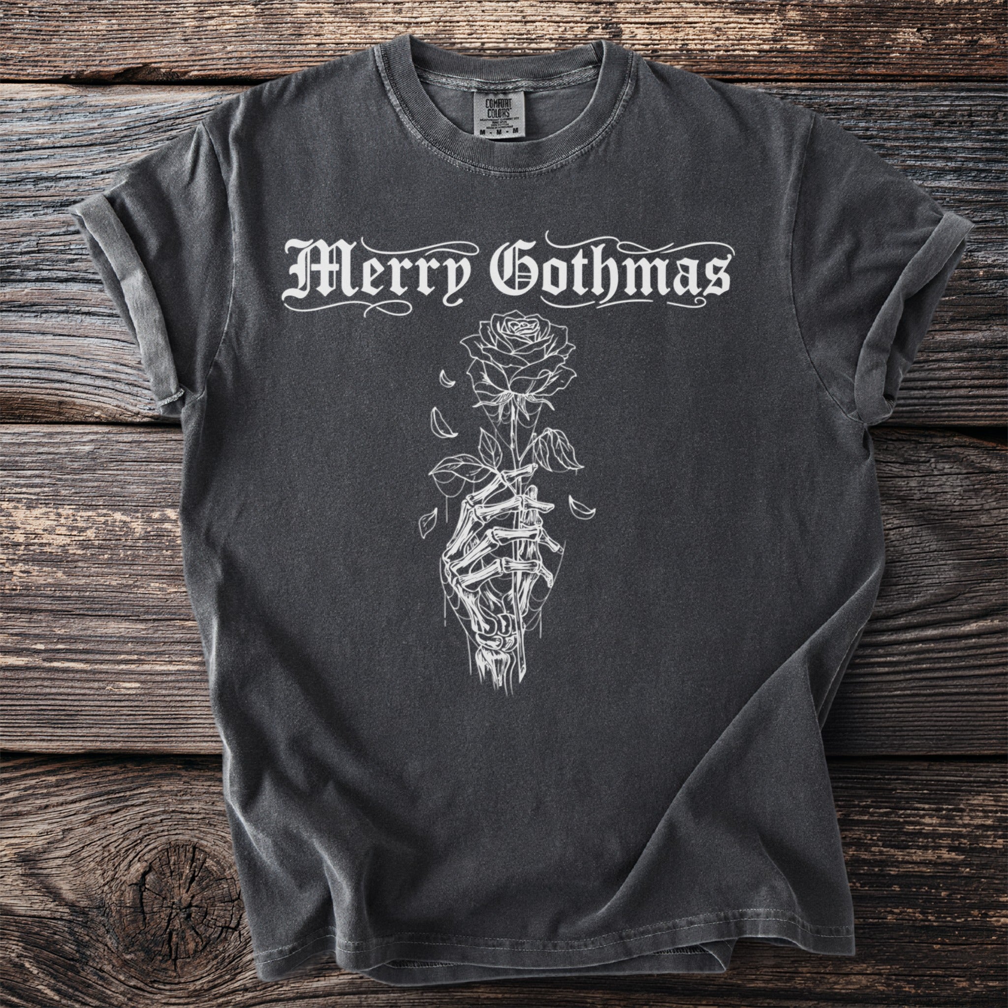 Charcoal t-shirt with white "Merry Gothmas" text and a skeleton hand holding a rose.