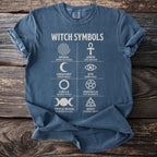 Blue t-shirt with white "WITCH SYMBOLS" text and multiple occult symbols.
