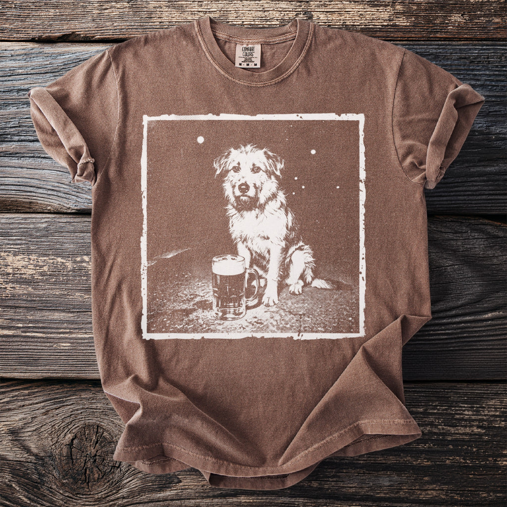 Brown t-shirt with a white graphic of a dog sitting next to a beer mug.
