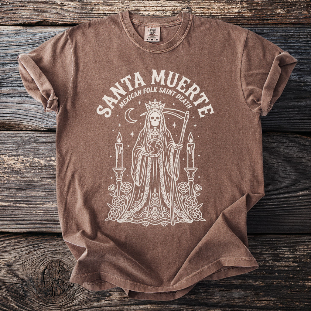Brown t-shirt with "Santa Muerte Mexican Folk Saint Death" graphic of a robed skeleton holding the Earth.