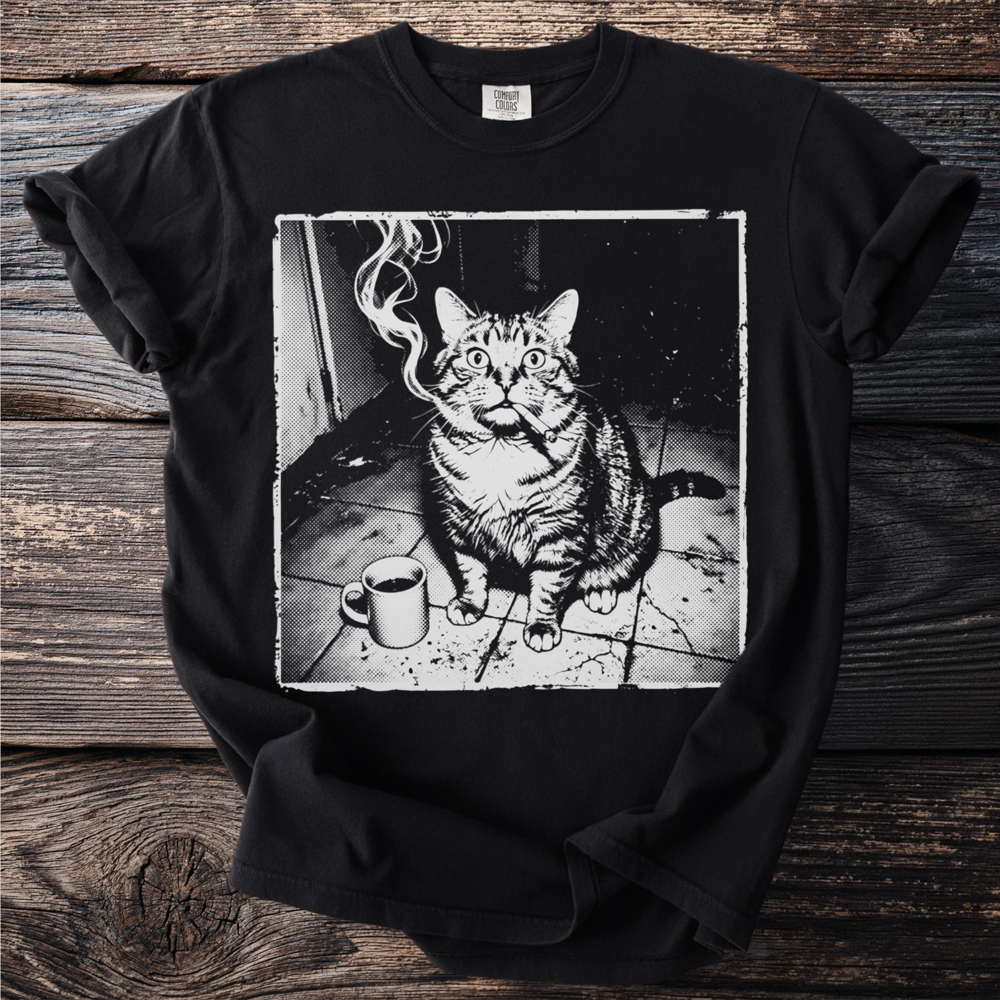 Black t-shirt with a graphic of a grumpy cat with a cigarette and coffee mug.