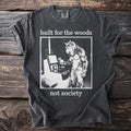T-shirt with wolf-man at computer and text "built for the woods not society".