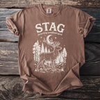 Brown t-shirt with white stag, forest, moon, and "STAG forest king woodland spirit" text.