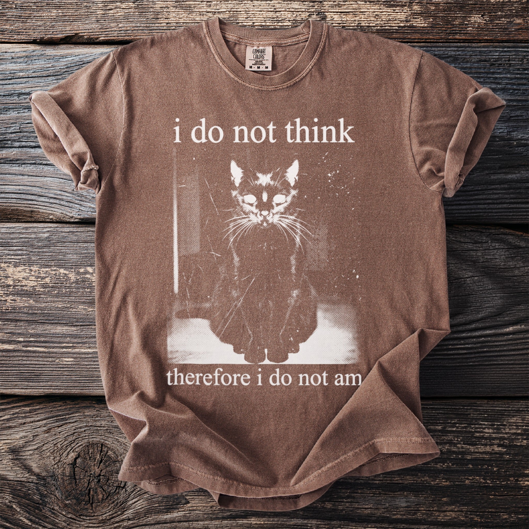 Brown t-shirt with "i do not think therefore i do not am" text and a cat graphic.