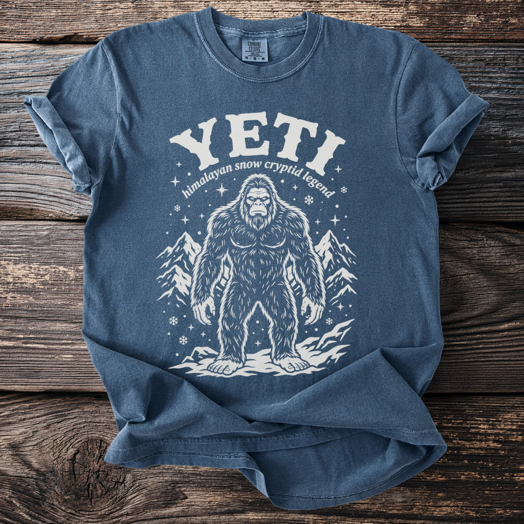 Blue t-shirt with Bigfoot graphic and text "YETI himalayan snow cryptid legend".