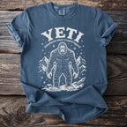 Blue t-shirt with Bigfoot graphic and text "YETI himalayan snow cryptid legend".