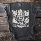 Dark gray t-shirt with white print of arctic animals and text: "respect the locals".