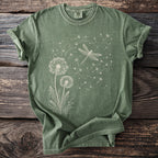 Green t-shirt with a line drawing of dandelions and a dragonfly.