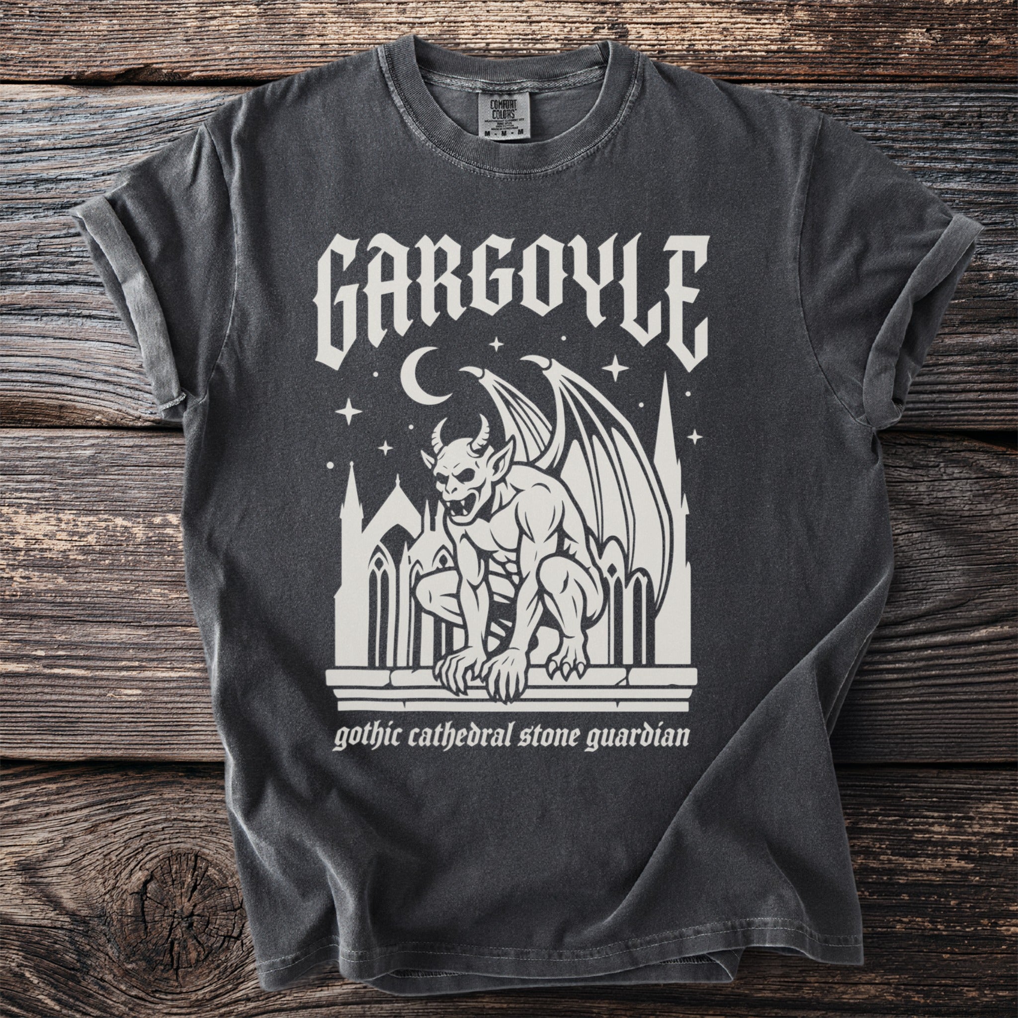 Dark charcoal t-shirt with white gothic gargoyle design and text "gothic cathedral stone guardian".