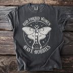 Dark grey t-shirt with white text and graphics of a moth and moon phases.