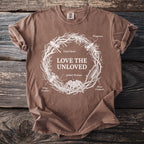 Brown t-shirt with "LOVE THE UNLOVED" and various insects in a circular design.