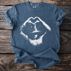 Blue Comfort Colors t-shirt with white graphic of lips forming a heart, wearing a hat.