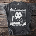 Charcoal t-shirt with opossum smoking and text "don't tell me what to do."