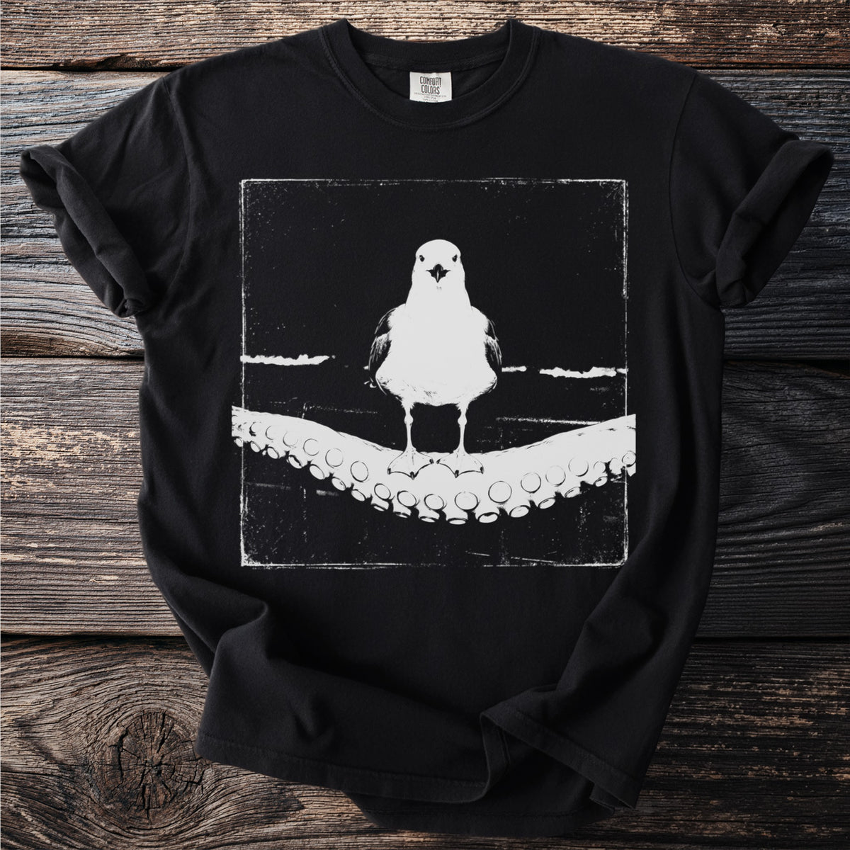 Black t-shirt with a white graphic of a seagull on octopus tentacles.