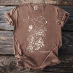 Brown shirt with witch silhouette, Jimsonweed, and Deadly Nightshade botanical illustration.