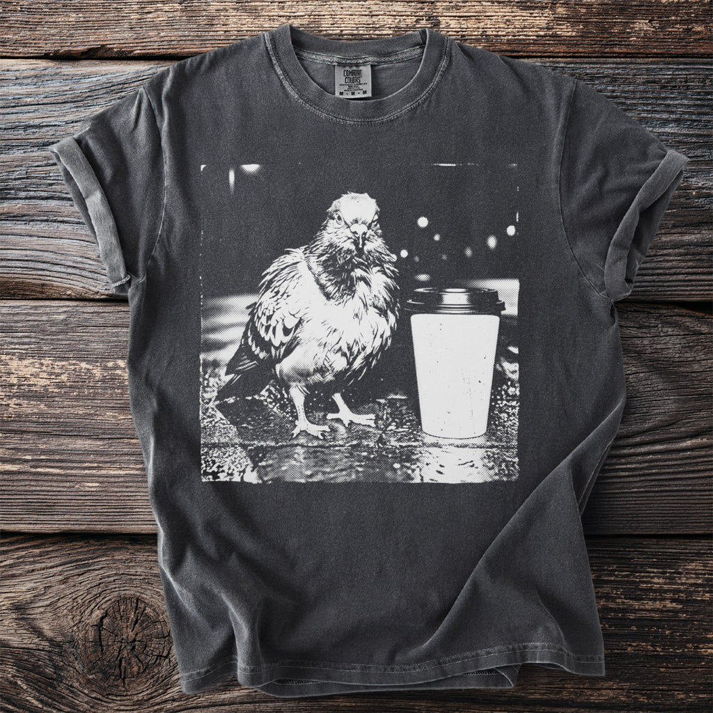T-shirt with black and white graphic of a pigeon and a coffee cup.