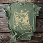 Green t-shirt with a distressed print of an owl wearing a graduation cap.