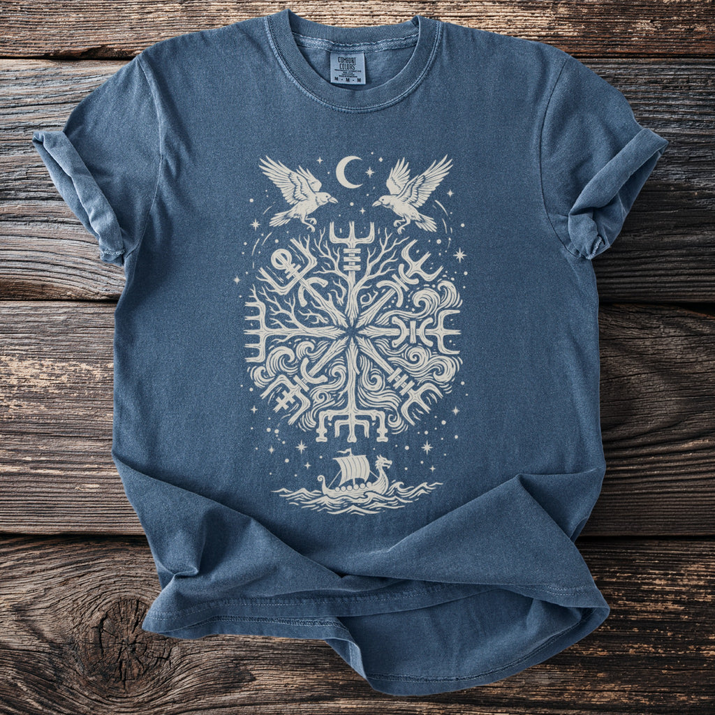 Blue t-shirt with white Norse symbols, two ravens, moon, and a Viking ship.