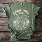 Green t-shirt with "BABA YAGA russian witch folklore tale" and illustration.
