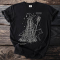 Witch with staff and dog on black t-shirt, with "Monkshood" and "Black Hellebore" text.
