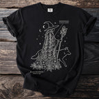 Witch with staff and dog on black t-shirt, with "Monkshood" and "Black Hellebore" text.