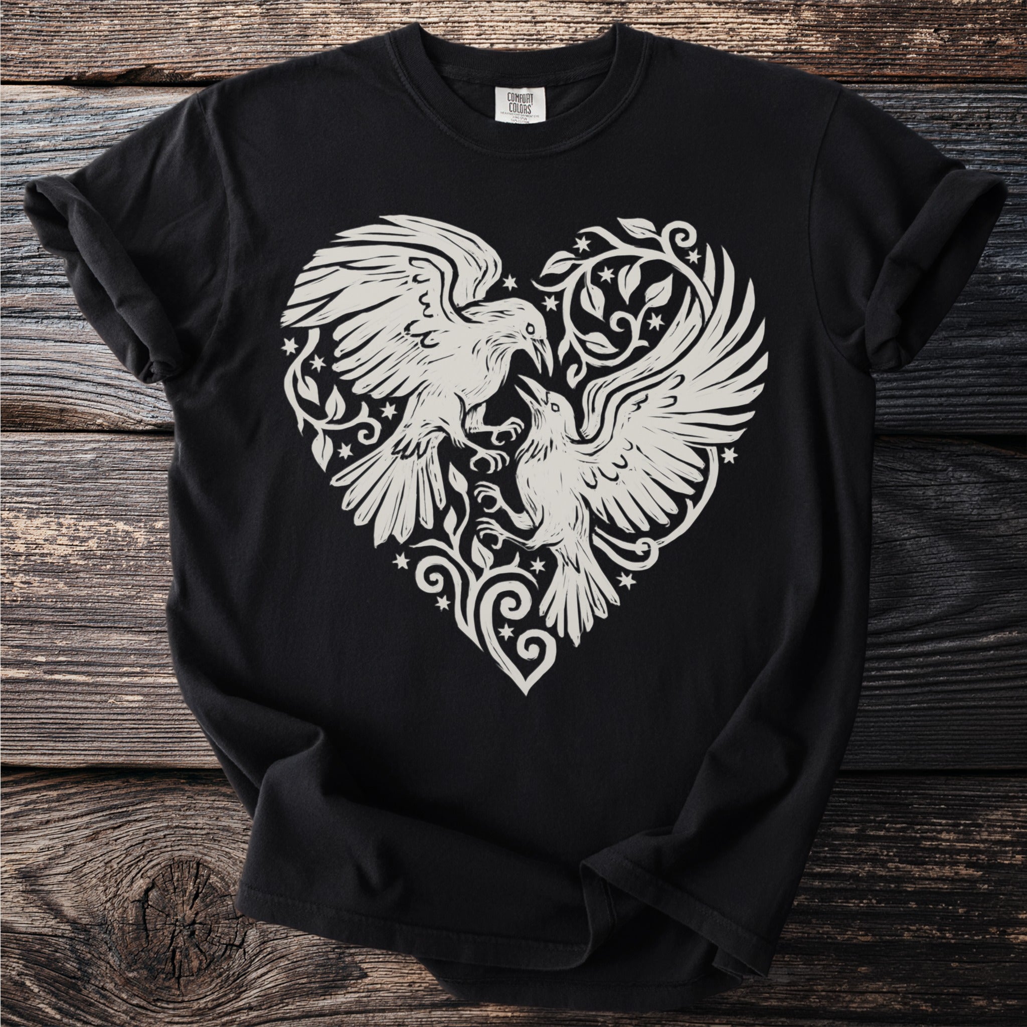 Black t-shirt with white graphic of two birds within a heart shape.